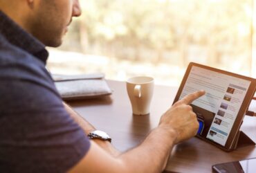 man holding tablet computer