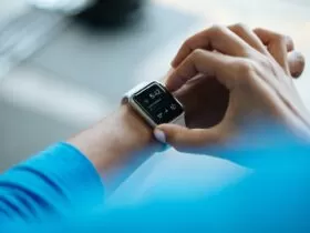 person clicking Apple Watch smartwatch