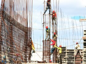 people working on building during daytime